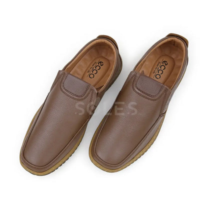 Pair of SOLES E-72 mustard tan-brown leather slip-on shoes from above, showing the tan lining, elastic side panels and stitched vamp overlay
